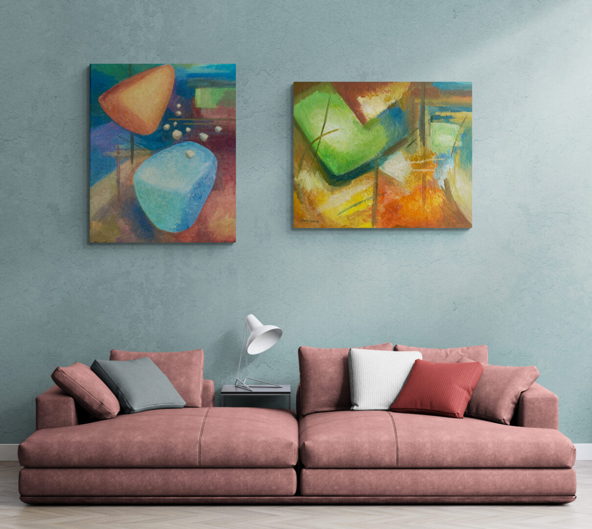 A living room with two local fine art paintings for sale on the wall.