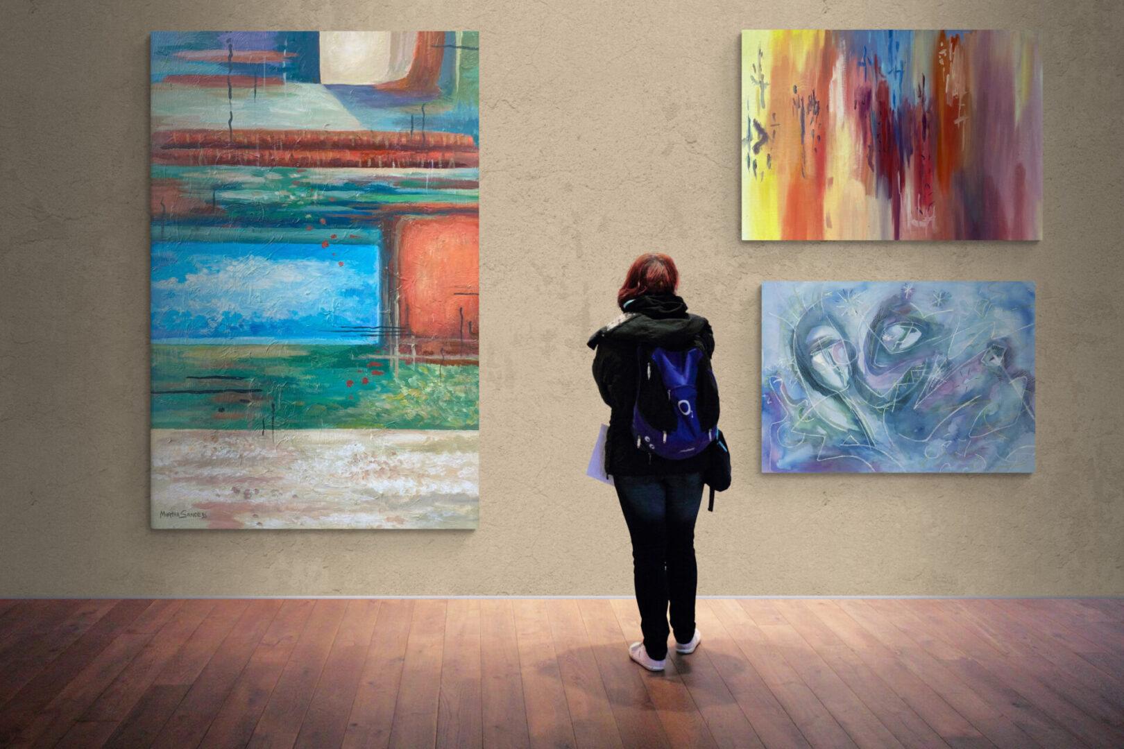 A woman browsing through local fine art for sale in an art gallery.